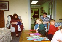 Photo of mothers and children in community room