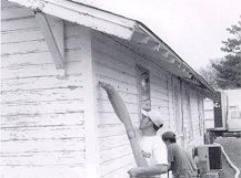 Photo of contract crew insulating a home