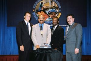 Photo of recipients receiving award from Secretary Cuomo & Deputy Secretary Ramirez 