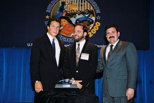 Photo of Dr. Don Chatfield receiving award from Secretary Cuomo and Deputy Secretary Ramirez