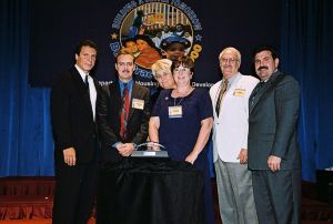 Photo of recipients receiving award from Secretary Cuomo & Deputy Secretary Ramirez