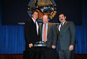 Photo of Michael McNamara receiving award from Secretary Cuomo & Deputy Secretary Ramirez