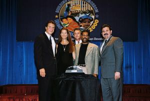 Photo of recipients receiving award from Secretary Cuomo & Deputy Secretary Ramirez