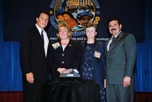 Photo of Jane Lahage & Patricia Quaig receiving award from Secretary Cuomo & Deputy Secretary Ramirez