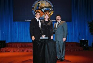 Photo of Robin Keller receiving award from Secretary Cuomo & Deputy Secretary Ramirez