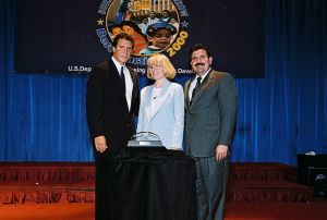 Photo of Robin Hanna receiving award from Secretary Cuomo & Deputy Secretary Ramirez