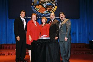 Photo of Eileen Hjorth, Rosemary Caps and Michael Telegose receiving award from Secretary Cuomo & Deputy Secretary Ramirez