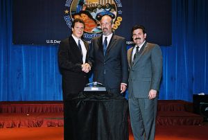 Mike Saklar receiving award from Secretary Cuomo & Deputy Secretary Ramirez