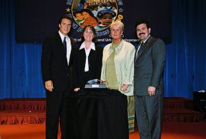 Photo of Sue Reamsnyder and Carolyn Martin-Giman receiving award from Secretary Cuomo & Deputy Secretary Ramirez