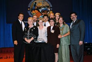 Photo of recipients receiving award from Secretary Cuomo & Deputy Secretary Ramirez