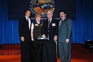 Photo of Gail Douglas & Ron Eberhardt receiving award from Secretary Cuomo & Deputy Secretary Ramirez