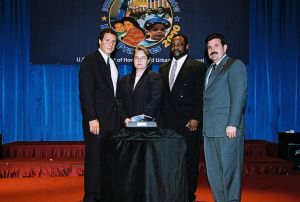 Photo of Debra DiSantis and Gregory Adkins receiving Best of
the Best award