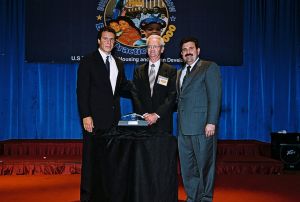 Photo of Donald Mitchell receiving award from Secretary Cuomo & Deputy Secretary Ramirez