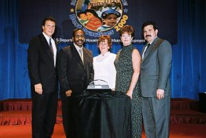 Photo of recipients receiving award from Secretary Cuomo & Deputy Secretary Ramirez