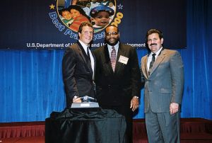 Photo of Abdur-Rahim Islam receiving award from Secretary Cuomo & Deputy Secretary Ramirez