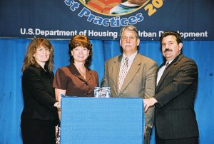 Rosetta Lucas (Center-L) Receiving Simply the Best Award