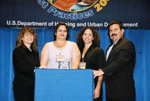 Daisy Caceres (Center-L) and Maria Juanarena (Center-R) Receiving Simply the Best Award