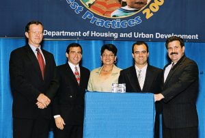 Alfredo Aciando, Maria Santiago, and Secretary Carlos Gonzales Receiving Simply the Best Award