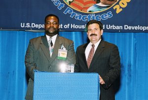 Gregory Adkins (L) Receiving Simply the Best Award