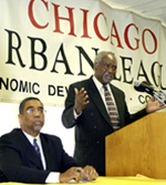 [Photo 1:  Congressman Rush listening to Congressman Davis at the podium]