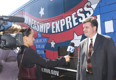 [Photo 3: Telemundo is interviewing John Carson]