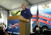 [Photo of Orange County Chairman Crotty at the podium]