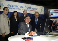 [Photo 1: Secretary Martinez surfing the website