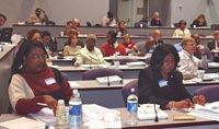 [Photo 2:  Class members listen attentively]