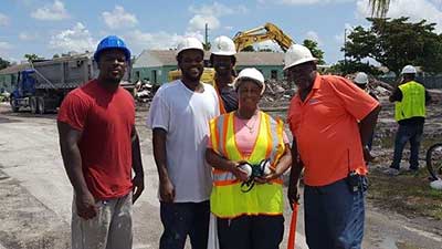 [Liberty Square residents and neighbors trained in several construction skills, now hired by RUNU to help with demolition of Liberty Square. From left, Henry Farmer, Leonard Johnson, Raphael White, Willie Phillips, Steve Lucien.]