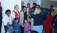 [Photo 3: Picture of the Armour family and Sue Straughn]