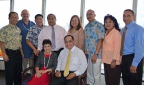 [Photo 1: Standing from l-r: Mike Flores, Mark Chandler, Ryan Okahara; Lt. Governor Eloy Inos; Marcie Tomokane, Jesse Palacios; Esther Fleming; and Tom Linde. Seated: Ophelia Basgal and Benigno Fitial]
