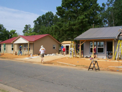 Photo 2: two homes under construction.