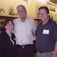 [Photo 1: Program Manager Diedra Osborn, Master Chef Michael Leon and Food Bank Executive Director Jim Presson celebrate the grand opening]