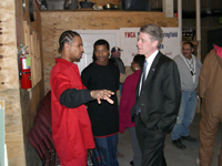 [Photo: Taylor Caswell with YouthBuild students]