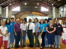 [Photo 1: hoMEworks board members and educators]