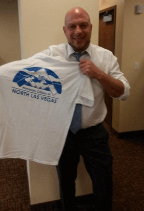 [Photo: Brian Sagert displays t-shirt]