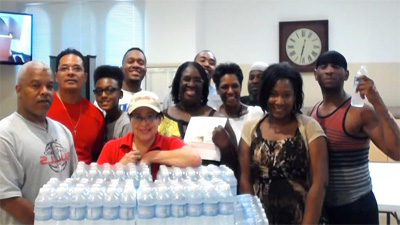 [Photo 1: Andrea Dempsey (center with cap) Community Connection Representative for Arizona Charlie's Hotel and Casino. Next to Andrea, Phyllis Hargrove, HUD Senior Management Analyst, Dollicia Partridge, Dog Catchers Youth Foundation, Duana Malone, TechQueen Systems (center). From left to right Henry Thorn, Dog Catchers Youth Foundation, Robert Lewis, NUFF SED Youth Foundation, Maxwell Lewis, NUFF SED Youth Foundation, Mario Lewis, NUFF SED Youth Foundation, Elijah Robertson , NUFF SED Youth Foundation, Ahmad Ade, Al Maun, and Toiyaun Pierre Forte, NUFF SED Youth Foundation.]