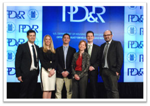 [Photo: The NYU Team: Constantine Caloudas, Michelle Guber, Peter Lovanella, Kathy O'Regan (HUD), Matthew Jupin and Christopher Hayner]