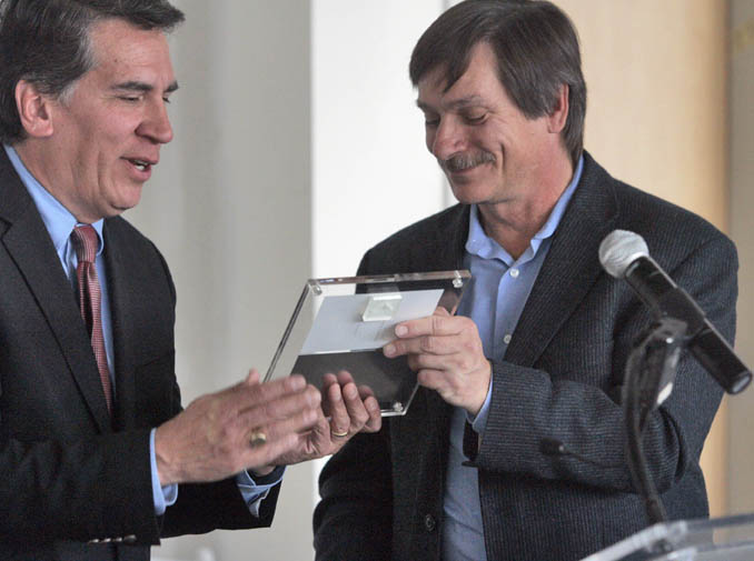 [Photo 2: Regional Administrator Rick Garcia accepts plaque from John Parvensky]