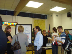 [Photo 3: Steve Gordon and Community Planning staff provide information to residents]