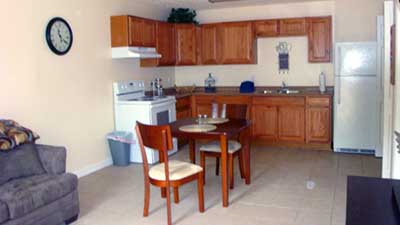 [Photo 1: Patriot Place Living room & kitchen]