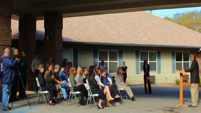 [Photo 2: Ed Ellis, Knoxville Field Office Director, addresses crowd at 'Raise the Roof' event.]