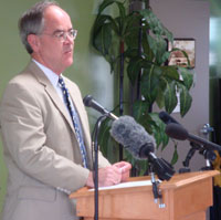 [Photo 1: Congressman Jim Cooper addressing the audience]