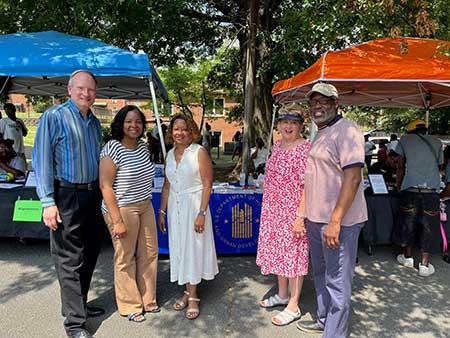[HUD teamed-up with the Jackson Housing Authority on June 29 in Jackson Tennessee to conduct an Affordable Connectivity Program outreach event at their Family Empowerment Expo. Left to right are Walter Perry, HUD Memphis Field Office Director; Michelle McCarroll, HUD Supervisory Management Analyst; Demetra Daniel, HUD Portfolio Management Specialist; Jo Alred, Board Chair, Jackson Housing Authority; and Mark Reid, Executive Director, Jackson Housing Authority.]