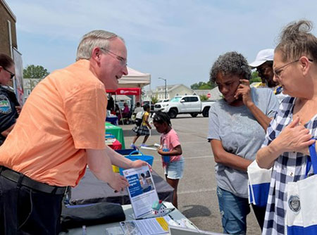 [Knoxville Field Office Director Walter Perry shares information about the Affordable Connectivity Program at the Five Points Community Back-to-School event. HUD participation was a team effort by Tennessee's Public and Indian Housing Staff and Field Policy and Management in partnership with Knoxville's Community Development Corporation.]