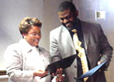 [Photo 4: Dr. Pringle awards departing President, Victoria Brown a Certificate of Appreciation]