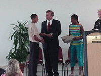 [Photo 2: Poster Contest winner receives award.]