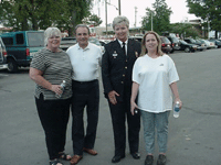 [Photo 3: Acting Chief of Police and others gather to take a picture.]