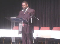 [Photo 1: Dr. Edward L. Pringle at the podium]