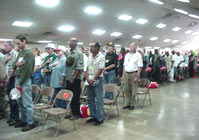 [Photo 2: Veterans standing for the Pledge of Allegiance]